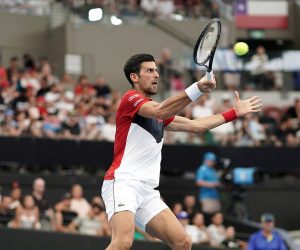 epa08111430 Novak Djokovic of Serbia in action against Cristian Garin of Chile (not pictured) during day six of the ATP Cup tennis tournament at Pat Rafter Arena in Brisbane, Australia, 08 January 2020.  EPA/DAVE HUNT AUSTRALIA AND NEW ZEALAND OUT  EDITORIAL USE ONLY
