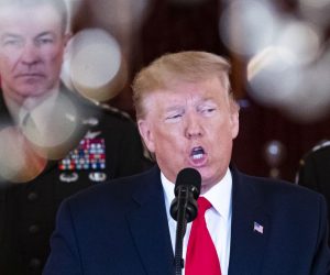 epa08112669 US President Donald J. Trump (C) is seen behind a chandelier delivering a statement on the US response to Iranian missile strikes, in the Grand Foyer of the White House in Washington, DC, 08 January 2020. Iran has launched missile strikes against two military bases in Iraq that house US forces, in retaliation to the killing of Iranian Revolutionary Guards Corps Lieutenant general and commander of the Quds Force, Qasem Soleimani, by a US drone strike in Baghdad.  EPA/MICHAEL REYNOLDS