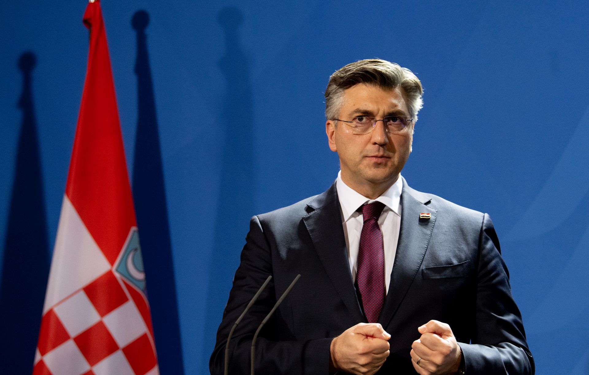 epa08133794 Croatian Prime Minister Andrej Plenkovi speaks as he attends a press statement with German Chancellor Angela Merkel at the Chancellery in Berlin, Germany, 16 January 2020. Merkel and Plenkovic met for bilateral talks.  EPA/FILIP SINGER