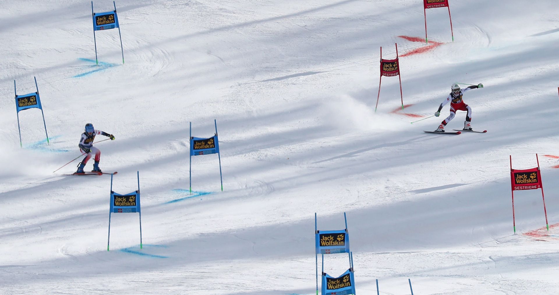 epa08140974 Second placed Elisa Moerzinger (R) of Austria and winner Clara Direz (L) of France in action at the final round during the women's Parallel Giant Slalom race at the FIS Alpine Skiing World Cup event in Sestriere, Italy, 19 January 2020.  EPA/ANDREA SOLERO
