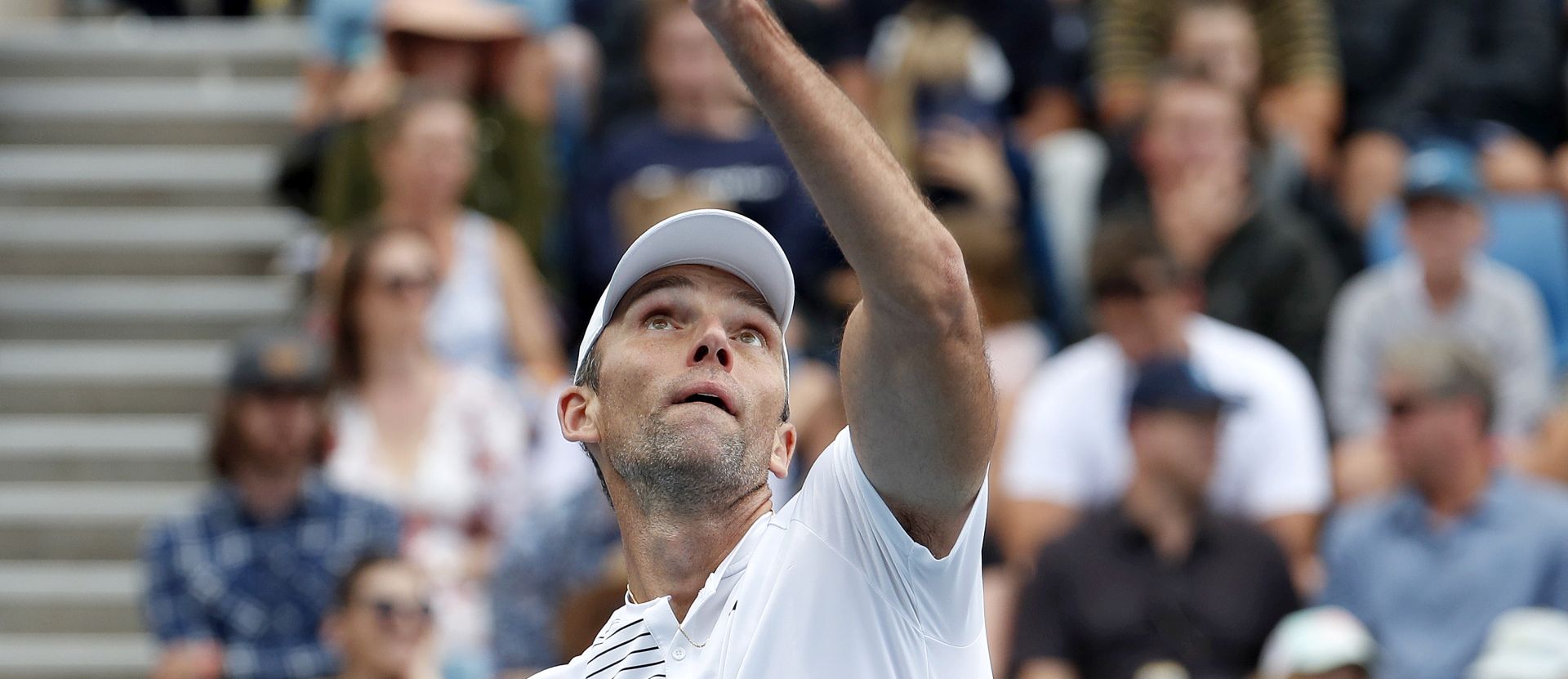 epa08153223 Ivo Karlovic of Croatia in action during his men's singles second round match against Gael Monfils of France at the Australian Open Grand Slam tennis tournament in Melbourne, Australia, 23 January 2020. EPA/ROMAN PILIPEY