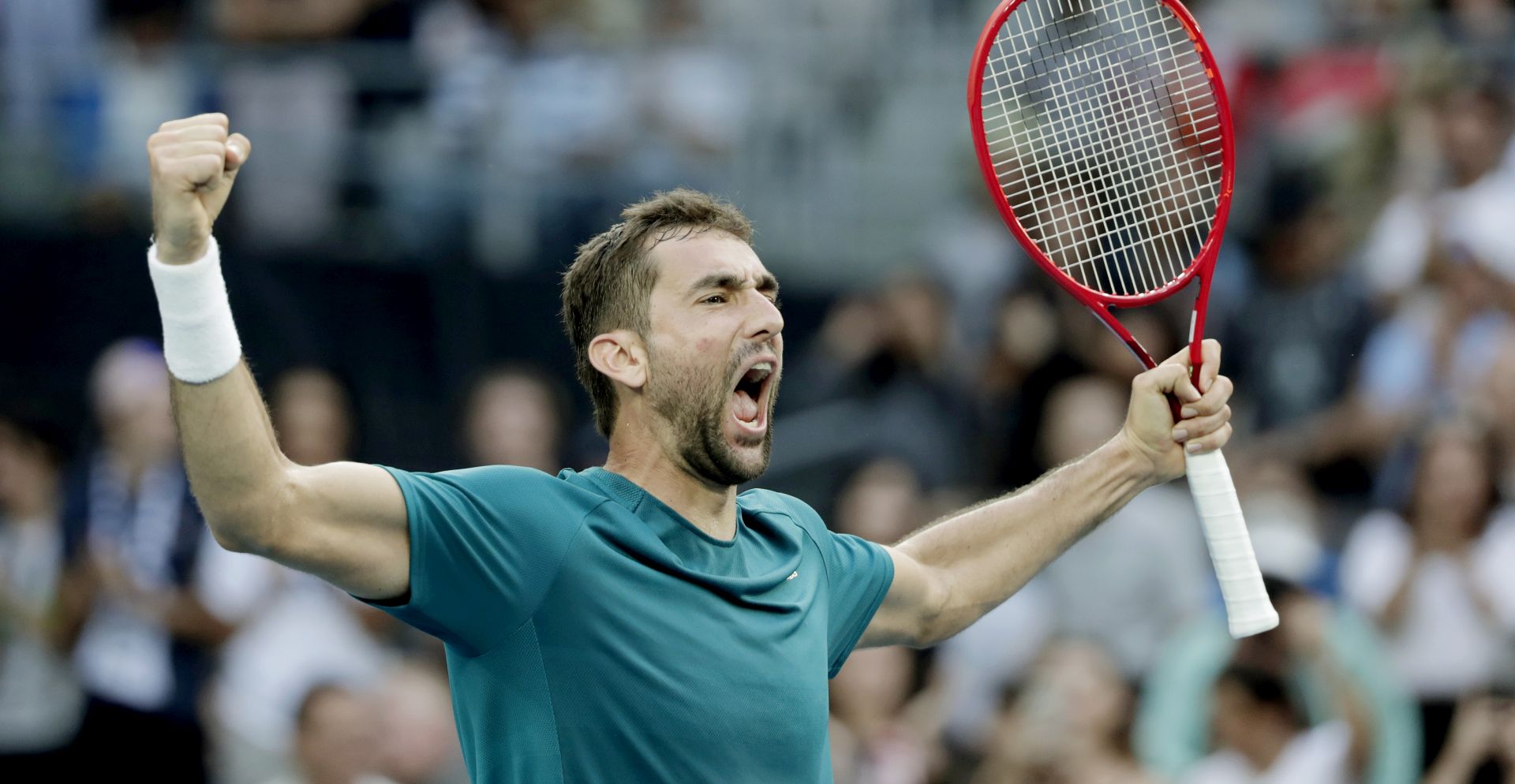epa08157709 Marin Cilic of Croatia celebrates winning his men's singles third round match againstRoberto Bautista Agut of Spain at the Australian Open Grand Slam tennis tournament in Melbourne, Australia, 24 January 2020. EPA/LYNN BO BO