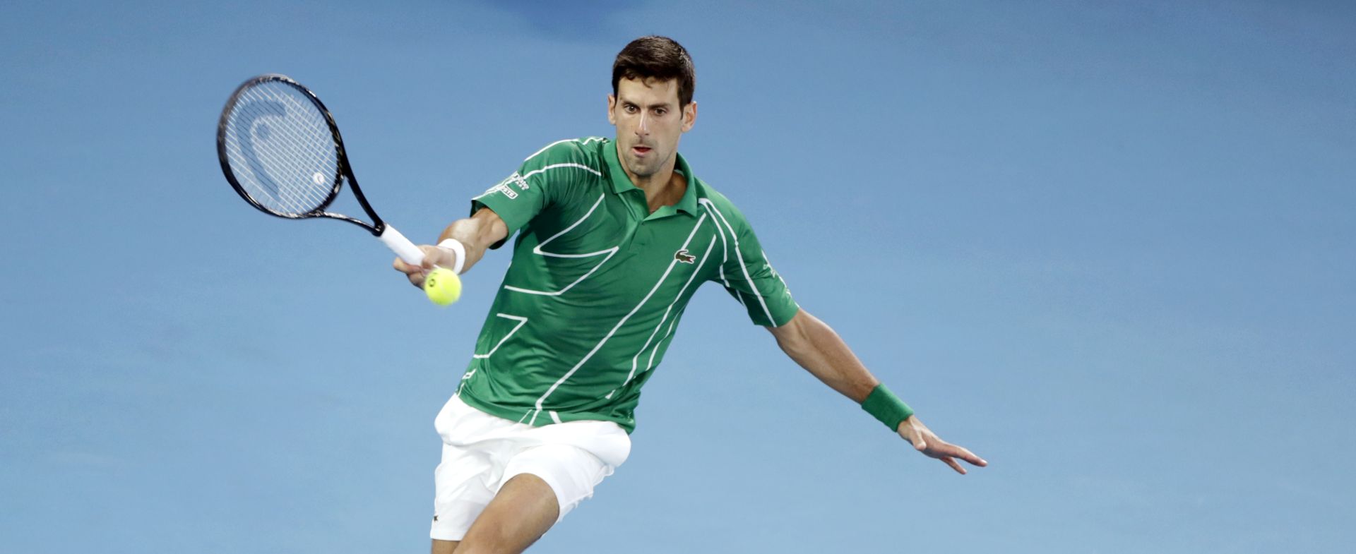 epa08171868 Novak Djokovic of Serbia in action during his men's singles quarterfinal match against Milos Raonic of Canada at the Australian Open Grand Slam tennis tournament in Melbourne, Australia, 28 January 2020. EPA/LYNN BO BO