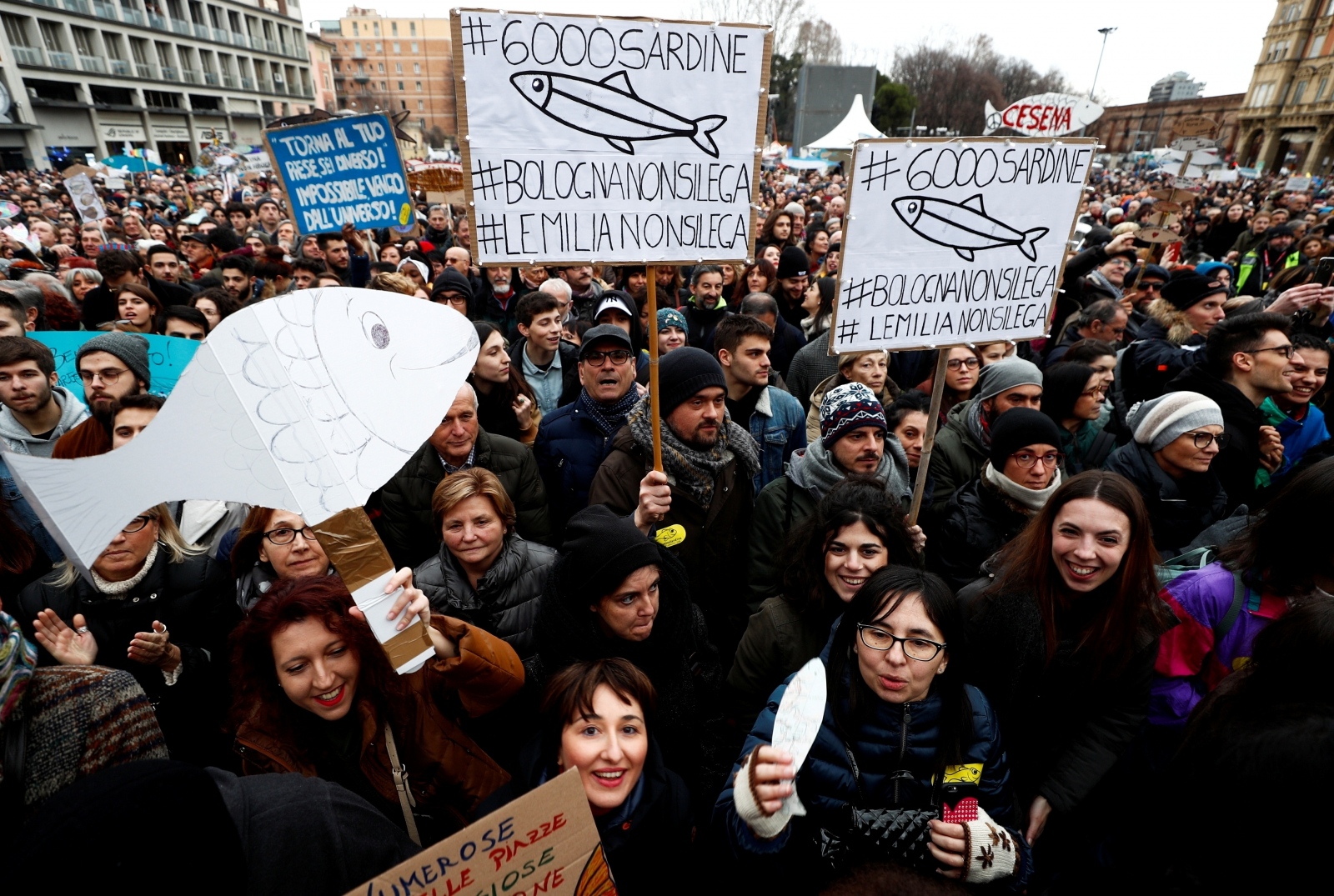 Protesters attend a demonstration held by "the sardines", a grassroots movement against far-right League leader Matteo Salvini, in Bologna Supporters of "the sardines", a grassroots movement against far-right League leader Matteo Salvini, hold placards during a demonstration in Bologna, Italy, January 19, 2020. REUTERS/Guglielmo Mangiapane Guglielmo Mangiapane