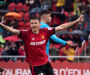 epa08140733 RCD Mallorca's Croatian forward Ante Budimir (L) celebrates with his teammate Antonio Raillo (R) after scoring against Valencia during their Spanish LaLiga game at Son Moix Stadium in Palma de Mallorca, Majorca island, Spain, 19 January 2020.  EPA/ATIENZA