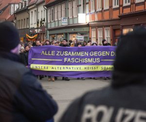 24 January 2020, Saxony-Anhalt, Salzwedel: People hold signs as they march during a demonstration against an event held by the Alternative for Germany (AfD) party at the municipal culture house of Salzwedel. Photo: Heiko Rebsch/dpa-Zentralbild/dpa