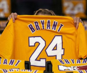 epaselect epa08183492 A woman looks at a late former Los Angeles Lakers Kobe Bryant t-shirt prior to the match between the Portland Trail Blazers and the Los Angeles Lakers at the Staples Center in Los Angeles, California, USA, 31 January 2020. Retired Los Angeles Lakers player Kobe Bryant died in a helicopter crash on 26 January 2020. Thousands of Kobe Bryant jerseys were displayed on the spectators seats as a gift.  EPA/ETIENNE LAURENT SHUTTERSTOCK OUT