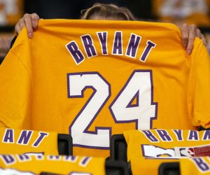 epaselect epa08183492 A woman looks at a late former Los Angeles Lakers Kobe Bryant t-shirt prior to the match between the Portland Trail Blazers and the Los Angeles Lakers at the Staples Center in Los Angeles, California, USA, 31 January 2020. Retired Los Angeles Lakers player Kobe Bryant died in a helicopter crash on 26 January 2020. Thousands of Kobe Bryant jerseys were displayed on the spectators seats as a gift.  EPA/ETIENNE LAURENT SHUTTERSTOCK OUT