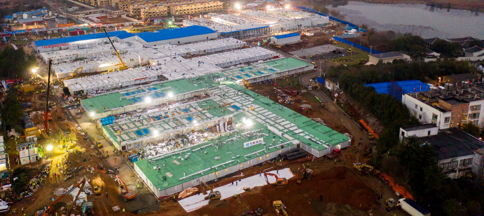 epa08187443 An aerial view shows the completed site of the Huoshenshan (Fire God Mountain) Hospital in Wuhan, Hubei Province, China, 02 February 2020. The construction of the 1,000-bed temporary field hospital, which began on 24 January 2020 to house novel coronavirus patients, was announced completed on 02 February.  EPA/YFC CHINA OUT