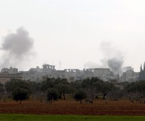 epa08192585 Smoke rises during government forces bombing on the village of Sarman, in Maarrat al-Nu'man district, Idlib, Syria, 04 February 2020. According to Syrian official news reports, the Syrian army units launched operation against last rebel-held stronghold in Idleb and the surrounding areas. According to the UN, 520,000 people were displaced since the operations began in December 2019.  EPA/YAHYA NEMAH