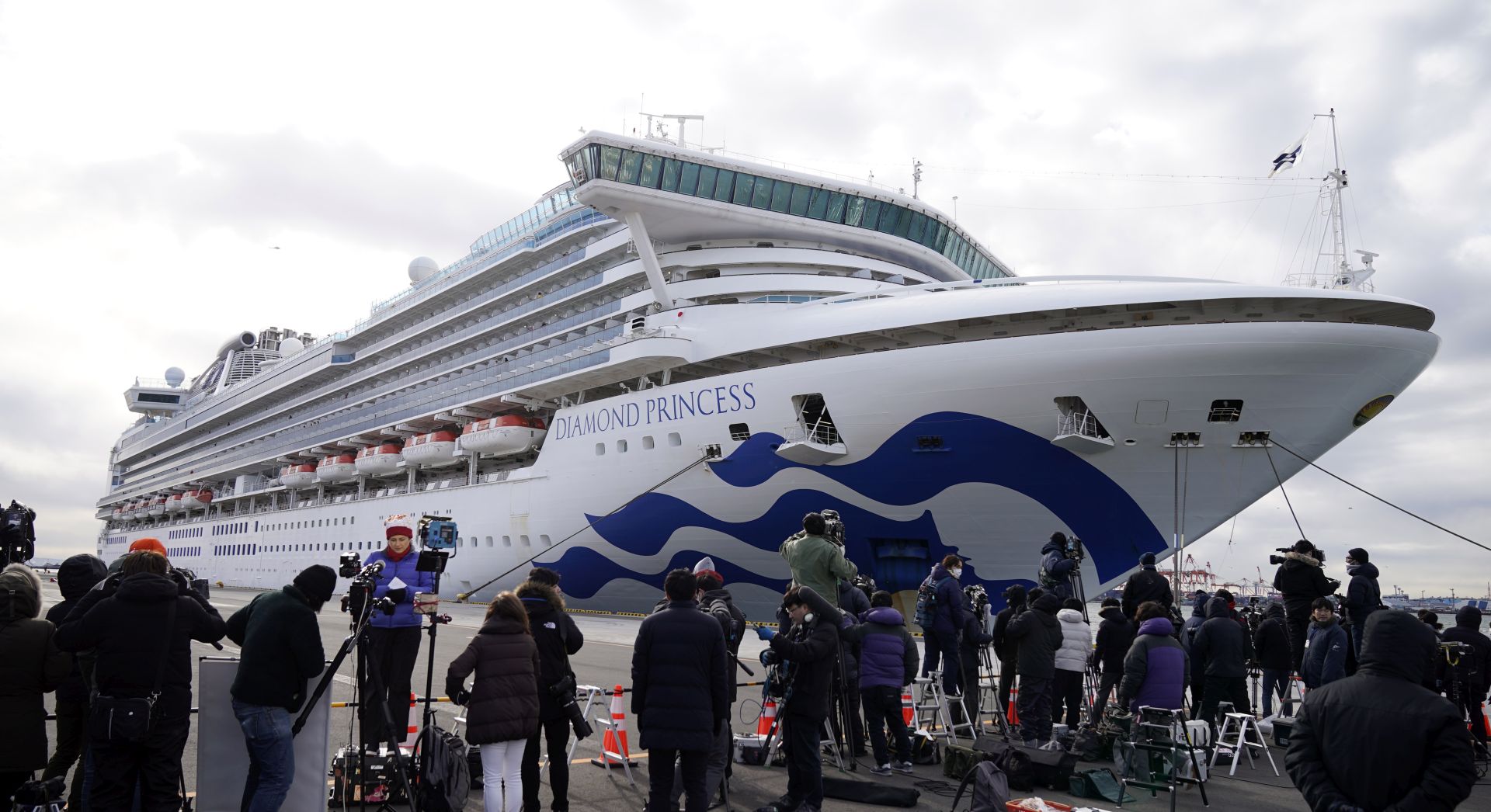 epa08196603 Media gather before the Diamond Princess cruise ship that docked at the port of Yokohama in Yokohama, Japan, 06 February 2020. The cruise ship with around 3,700 passengers on board docked in the morning to restock supplies. According to latest media reports, 10 more people have tested positive for the new coronavirus. A total number of 20 people from the ship have been infected by the coronavirus, raising the number of infections to 45 in Japan. According to media reports, around 28,000 people are infected and at least 563 have died from coronavirus.  EPA/FRANCK ROBICHON