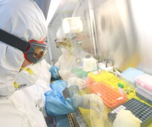 epa08199487 A staffer works in the pop-up Huoyan Laboratory specialized in the nucleic acid test on the novel coronavirus (2019-nCoV) in Wuhan, Hubei province, China, 06 February 2020 (issued 07 February 2020). The P2-level biosafety lab was built in five days, designed to perform 10,000 coronavirus tests per day to cope with the outbreak. The virus, which originated in the Chinese city of Wuhan, has so far killed at least 638 people and infected over 31,000 others, mostly in China.  EPA/SHEPHERD ZHOU CHINA OUT