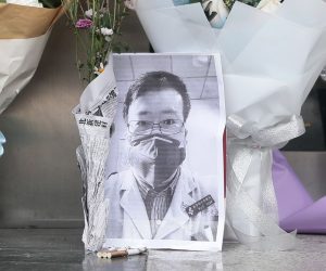 epa08199438 A picture of Dr. Li Wenliang, the Chinese whistle-blower who tried to sound the alarm on the coronavirus but was reprimanded by authorities, sits among offerings at a makeshift shrine outside the Wuhan Central Hospital in Wuhan, Hubei Province, China, 07 February 2020. The doctor died from the disease on 07 February. Wuhan Central Hospital initially denied the doctor’s death and confirmed it only later on, causing an outpouring of grief and anger through Chinese social media from people who hailed him as a hero. The virus, which originated in the Chinese city of Wuhan, has so far killed at least 638 people and infected over 31,000 others, mostly in China.  EPA/YFC CHINA OUT