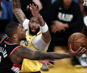 epa08183646 Portland Trail Blazers guard Damian Lillard (L) in action against LA Lakers forward-center Anthony Davis (R) during the match between the Portland Trail Blazers and the Los Angeles Lakers at the Staples Center in Los Angeles, California, USA, 31 January 2020.  EPA/ETIENNE LAURENT  SHUTTERSTOCK OUT