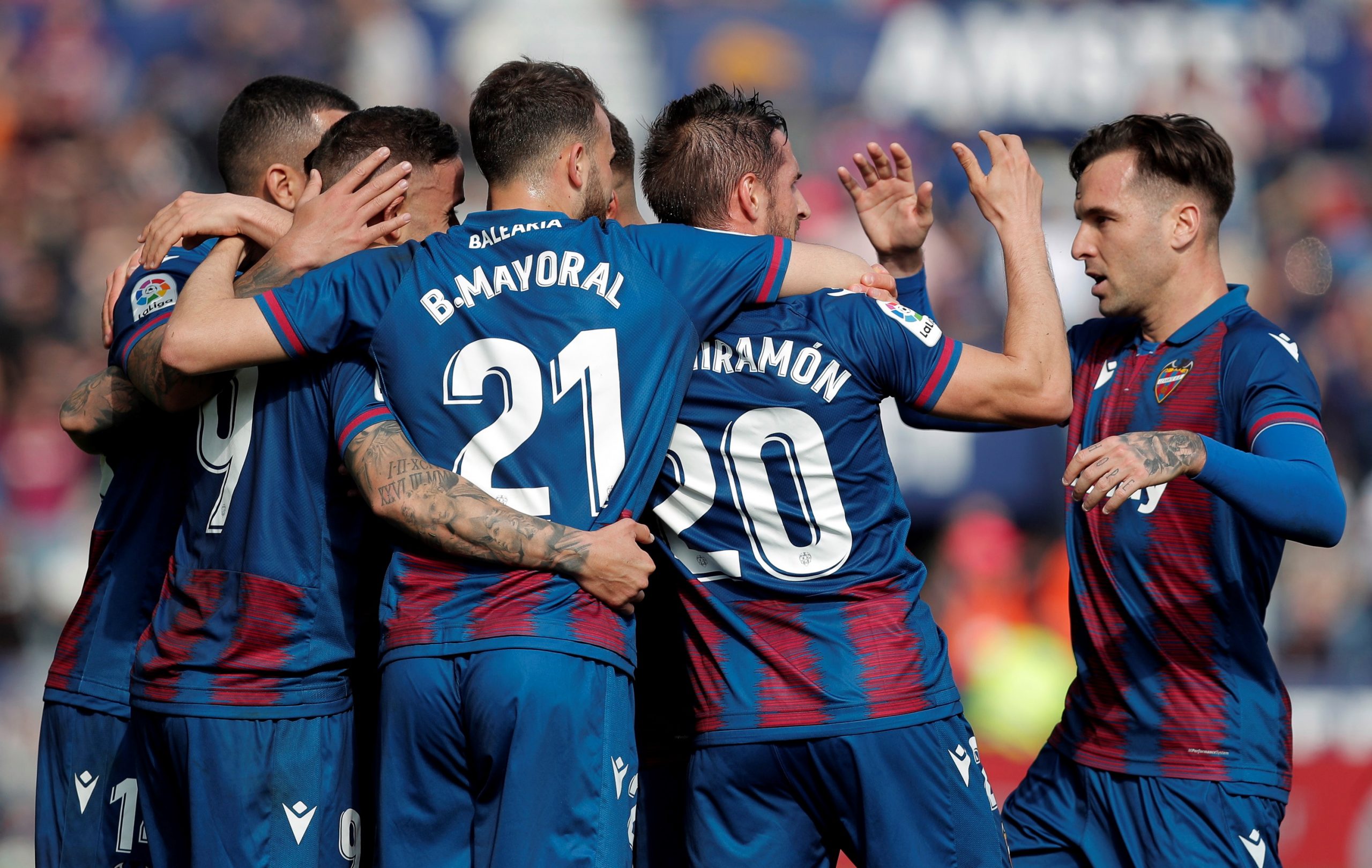 epa08202611 Levante forward Roger Marti (R) celebrates with teammates after scoring a goal during the Spanish LaLiga match between Levante UD and CD Leganes at Ciudad de Valencia Stadium, in Valencia, eastern Spain, 08 February 2020.  EPA/KAI FOERSTERLING