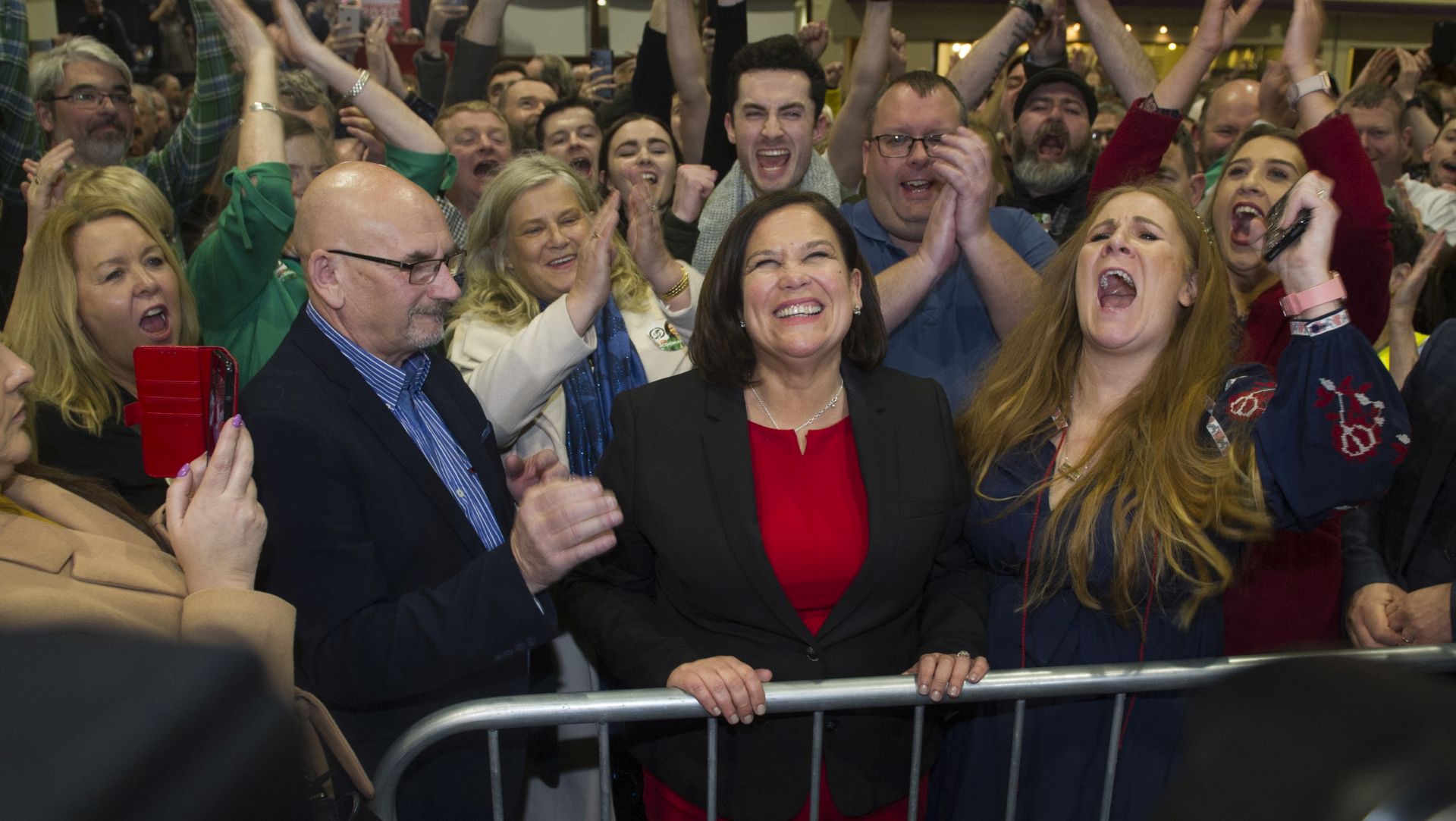 epa08206194 Sinn Fein president Mary Lou McDonald (C) reacts after being elected in her Dublin constituency at Dublin City count centre in Dublin, Ireland, 09 February 2020. Exit polls in the Irish general election suggest a three way tie between Fianna Fail, Fine Gael and Sinn Fein after the 08 February general elections.  EPA/AIDAN CRAWLEY