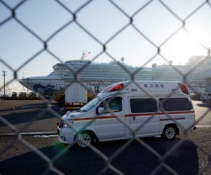 epa08214244 An ambulance believed to carry an infected passenger of the Diamond Princess cruise ship leaves the Daikoku Pier Cruise Terminal in Yokohama, south of Tokyo, Japan, 13 February 2020. According to latest media reports, another 44 passengers have been tested positive for the Covid-19 coronavirus, rising the total number of infections to 247 in Japan. The disease caused by the SARS-CoV-2 has been officially named Covid-19 by the World Health Organization (WHO). The outbreak, which originated in the Chinese city of Wuhan, has so far killed at least 1,369 people with over 60,000 infected worldwide, mostly in China.  EPA/FRANCK ROBICHON
