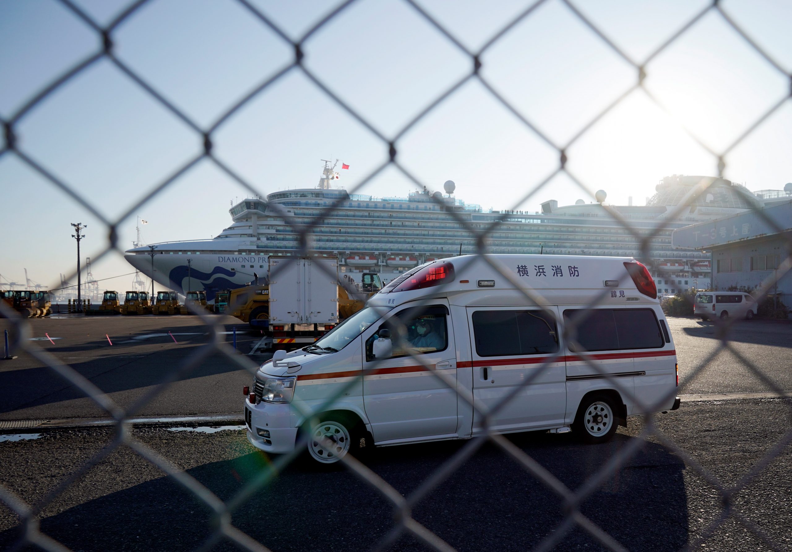 epa08214244 An ambulance believed to carry an infected passenger of the Diamond Princess cruise ship leaves the Daikoku Pier Cruise Terminal in Yokohama, south of Tokyo, Japan, 13 February 2020. According to latest media reports, another 44 passengers have been tested positive for the Covid-19 coronavirus, rising the total number of infections to 247 in Japan. The disease caused by the SARS-CoV-2 has been officially named Covid-19 by the World Health Organization (WHO). The outbreak, which originated in the Chinese city of Wuhan, has so far killed at least 1,369 people with over 60,000 infected worldwide, mostly in China.  EPA/FRANCK ROBICHON
