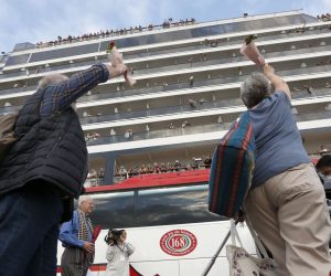 epaselect epa08216402 Passenger wave as they leave the MS Westerdam cruise ship at a seaport in Preah Sihanouk province, Cambodia, 14 February 2020. The Cambodian government allo?wed the MS Westerdam cruise ship, with about 2,000 passengers and crew aboard, to dock at Preah Sihanouk port on 14 February. The cruise ship was denied port by four countries over unsubstantiated reports that people infected with covid-19, were onboard.  EPA/MAK REMISSA