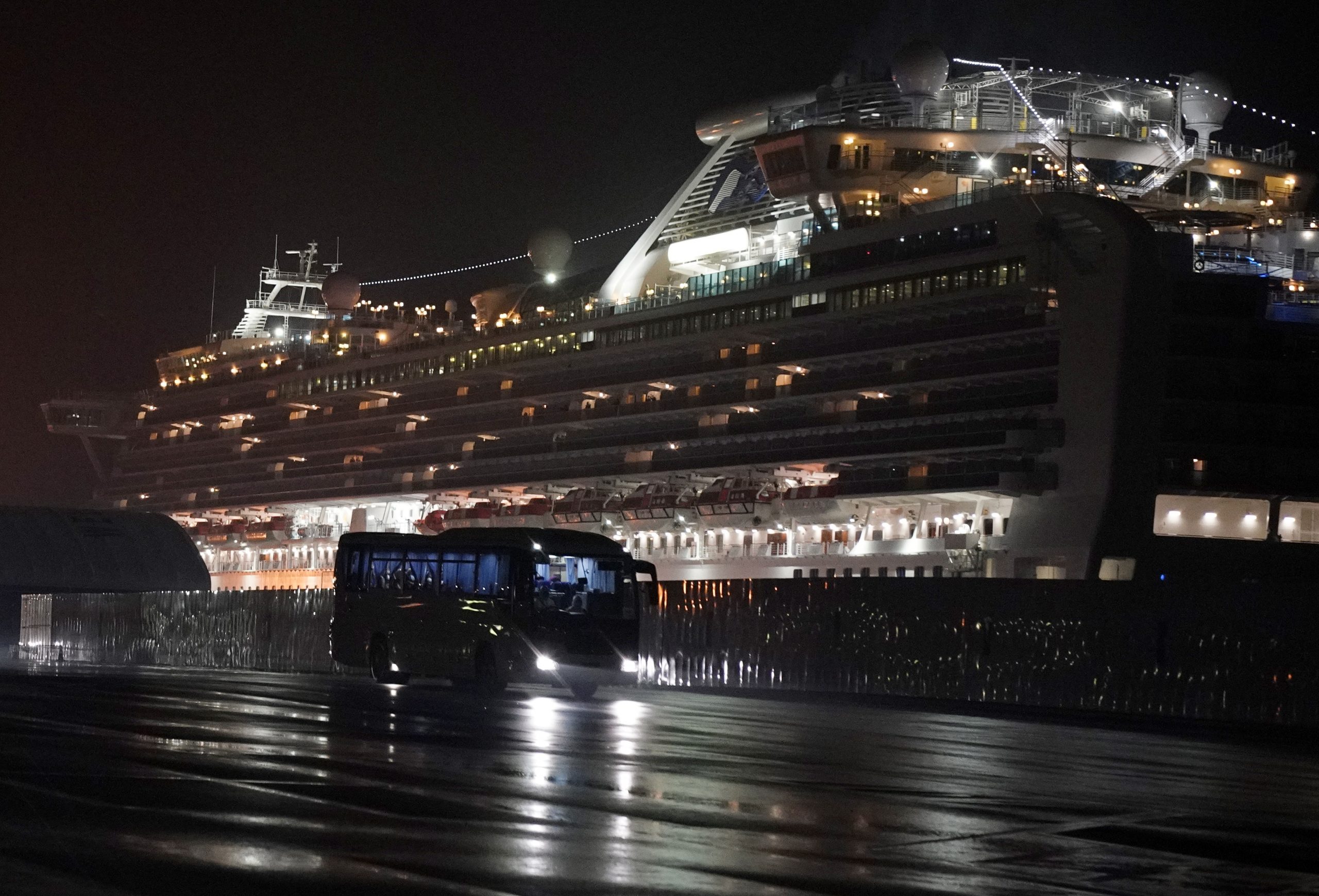 epa08222538 Buses carrying some 400 US citizens for repatriation leave the Daikoku Pier Cruise Terminal in Yokohama, south of Tokyo, Japan, early 17 February 2020. The US repatriated some 400 American citizens who had been aboard the 'Diamond Princess' cruise ship, which was quarantined amid the ongoing epidemic of the COVID-19 disease caused by the SARS-CoV-2 coronavirus.  EPA/FRANCK ROBICHON