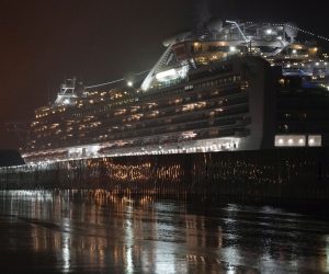 epa08223407 The Diamond Princess cruise ship is seen docked under heavy rain at the Daikoku Pier Cruise Terminal in Yokohama, south of Tokyo, Japan, 16 February 2020 (issued 17 February 2020). According to latest media reports on 17 February, another 99 passengers of the Diamond Princess cruise ship have been tested positive for the Covid-19 coronavirus, rising the total number of infections to 454 in the vessel.  EPA/FRANCK ROBICHON