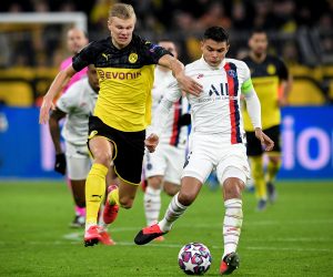 epa08226700 Dortmund's Erling Haaland (L) in action against PSG’s Thiago Silva (R) during the UEFA Champions League round of 16 first leg soccer match between Borussia Dortmund and Paris Saint-Germain in Dortmund, Germany, 18 February 2020.  EPA/SASCHA STEINBACH