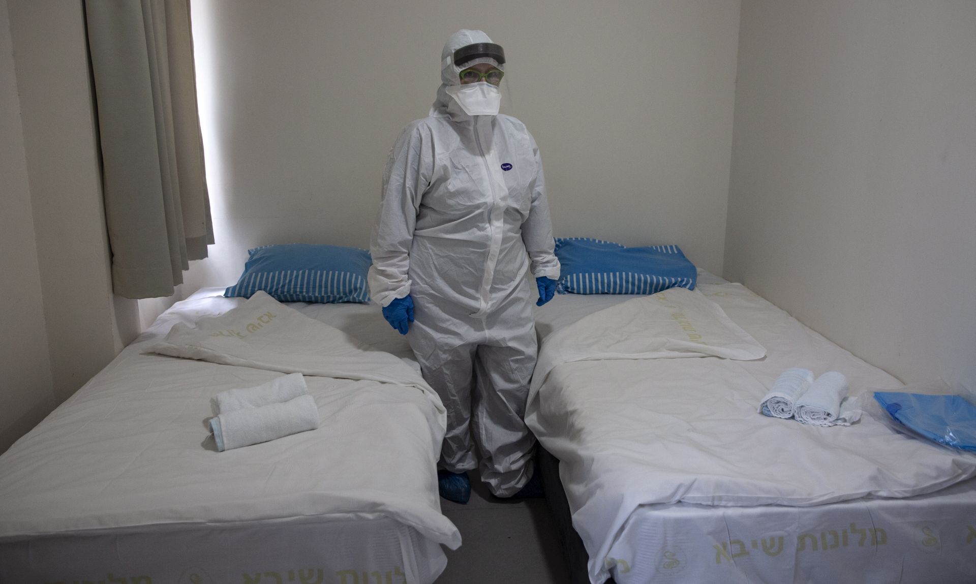 epa08227716 Israeli Professor Galia Rahavm the head of infectious diseases stands at one of the rooms where returning Israelis will stay under observation and isolation at the Chaim Sheba Medical Center at Tel Hashomer in Ramat Gan, Israel, 19 February 2020, for discussion on the Coronavirus. Doctors will monitor patients that have been in contact with the virus from the tent.  EPA/HEIDI LEVINE / POOL