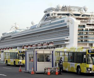 epa08233516 Buses leave the Daikoku Pier Cruise Terminal, where the Diamond Princess cruise ship is docked, in Yokohama, Japan, 21 February 2020. Since 19 February, passengers of the cruise ship have been disembarking, after going through a two-week-long quarantine period following the Covid-19 coronavirus outbreak.  EPA/FRANCK ROBICHON