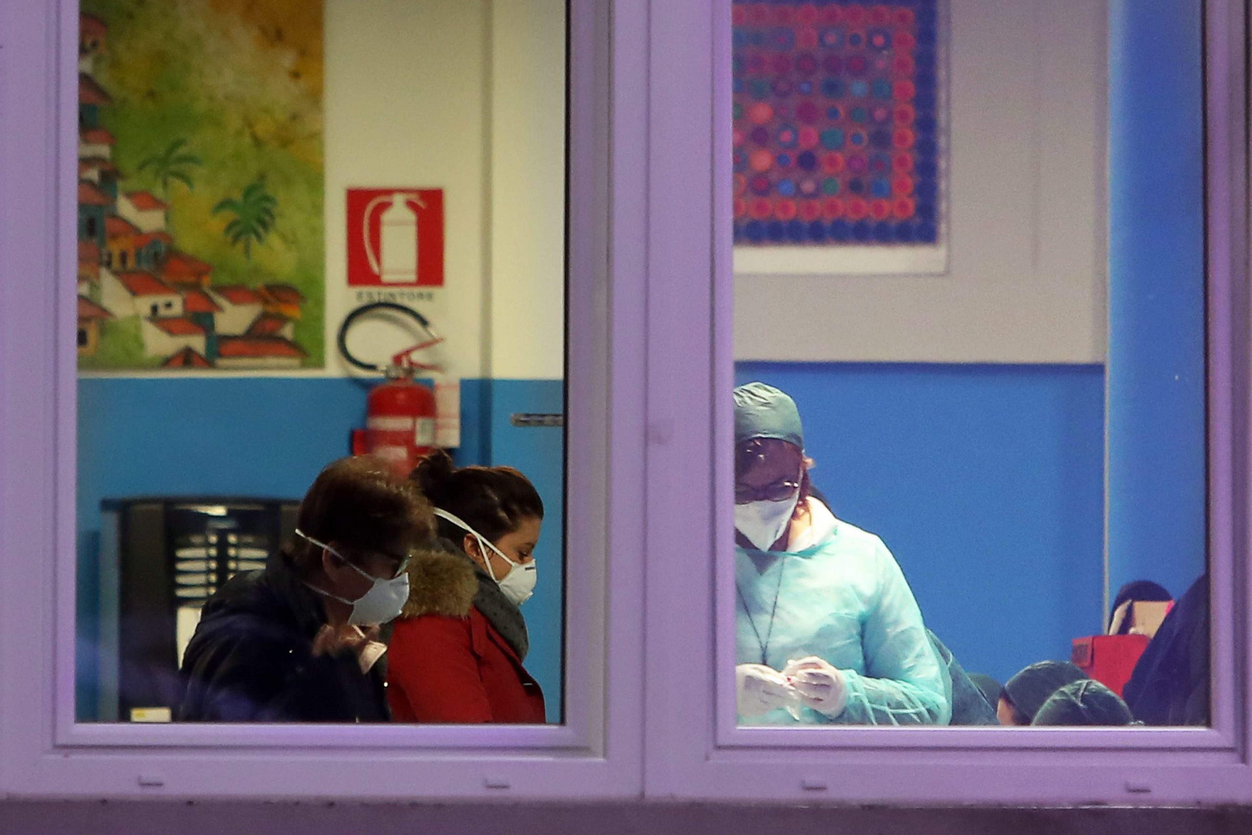 epa08241901 Medical personnel perform medical tests in Vo' Euganeo, Padova, Italy, 23 February 2020. Two deaths from the novel coronavirus sparked fears throughout northern Italy as about 50,000 people were poised for a weeks-long lockdown imposed by authorities trying to halt a further increase in infections. Italy on 21 February became the first country in Europe to report the death of one of its own nationals from the virus, triggering travel restrictions on about a dozen towns where the number of people contaminated has continued to rise.  EPA/NICOLA FOSSELLA