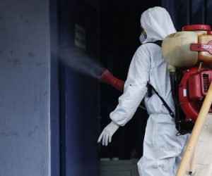 epa08253342 A man wearing a protective suit decontaminates a primary school where a child was diagnosed with coronavirus, Thessaloniki, Greece, 27 February 2020. The health ministry on Thursday announced two new cases of COVID-19 in the country, raising the number of patients taken ill with the virus to three.  EPA/DIMITRIS TOSIDIS