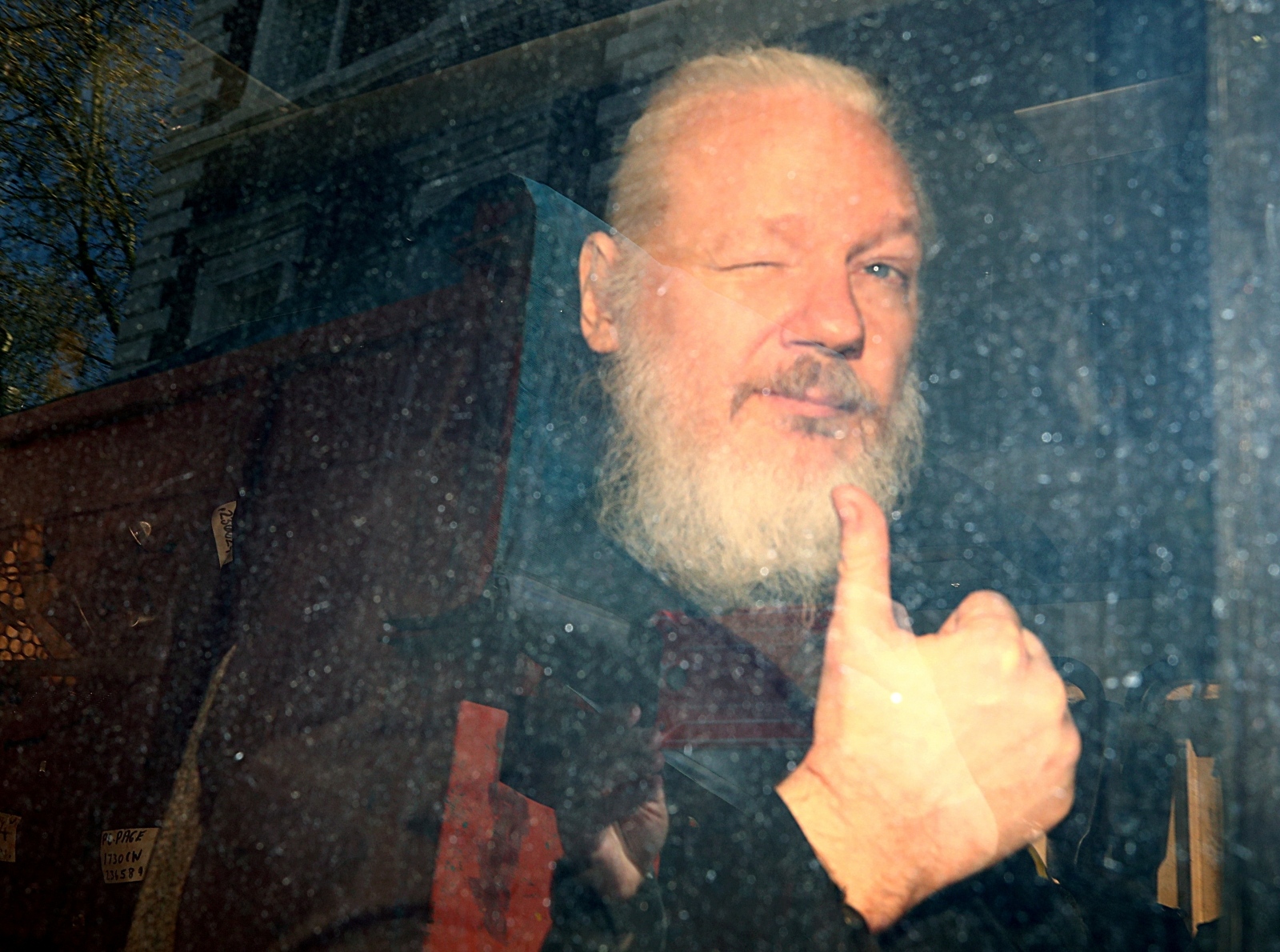 FILE PHOTO: Pictures of the Year: A Picture and its Story FILE PHOTO: WikiLeaks founder Julian Assange arrives at the Westminster Magistrates Court, after he was arrested  in London, Britain, April 11, 2019. Reuters Photographer Hannah McKay:/File Photo Hannah Mckay