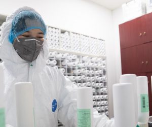 epa08264657 A staff member operates an intelligent dispensing machine for the production of traditional Chinese medicine (TCM) for coronavirus and COVID-19 patients in Tongji Hospital in Wuhan, China, 02 March 2020. The hospital has been using a mixture of TCM and western drugs to treat people infected with the coronavirus. Although there is no specific treatment for the COVID-19 disease, more than 80 percent of China's coronavirus patients were prescribed the use of TCM alongside Western drugs with experts citing a higher recovery rate compared to just the use of mainstream treatments, according to local reports.  EPA/YFC CHINA OUT
