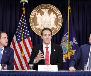 epa08265003 New York Governor Andrew Cuomo (C) speaks as New York City Mayor Bill de Blasio (R) and New York States’ Health Department Commissioner Dr. Howard Zucker (L) listen during a press conference about the city’s first known case of the coronavirus in New York, New York, USA, on 02 March 2020. The patient who tested positive for the virus is a healthcare worker who had recently travelled to Iran.  EPA/JUSTIN LANE