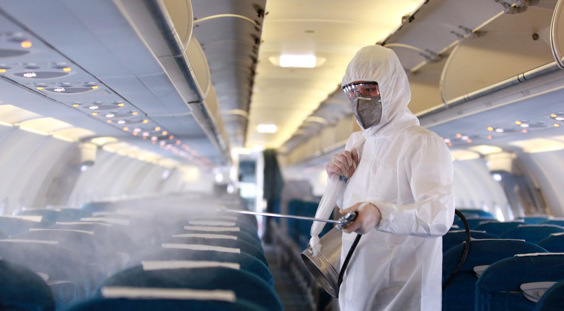 epaselect epa08265850 A worker sprays disinfectant as a precaution against the novel coronavirus, inside a Vietnam Airlines airplane at Noi Bai International Airport in Hanoi, Vietnam 03 March 2020. According to latest figures, all 16 people infected with coronavirus in Vietnam have recovered.  EPA/LUONG THAI LINH