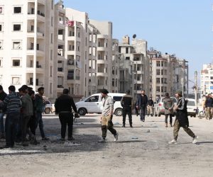 epa08266210 People inspect the site of explosion in Idlib, Syria, 03 March 2020. According to local media sources, at least eight people were killed and 21 were injured in an explosion in Idlib on 03 March, while the exact source of the explosion is not known yet.  EPA/YAHYA NEMAH
