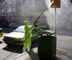 epa08271341 Members of Iranian fire fighters and municipality workers disinfect the streets of the capital city on Tehran, Iran, 05 March 2020. According the last report by the Ministry of Health, 2922 people diagnosed with the Covid-19 coronavirus and 92 people have died in Iran.  EPA/ABEDIN TAHERKENAREH
