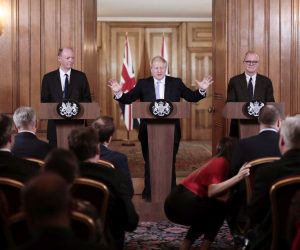 epa08281644 British Prime Minister Boris Johnson (C) speaks during a news conference while flanked by British chief medical officer Chris Whitty (L) and British lead science advisor Patrick Vallance (R) inside number 10 Downing Street in London, Britain, 09 March 2020. Johnson's spokesman said both the government and Bank of England are ready to take action to bolster the economy if needed.  EPA/JASON ALDEN / POOL