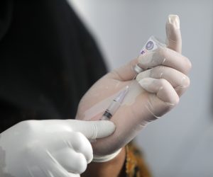 epa08287933 A nurse from Banda Aceh township public health department prepares vaccine injection for children during a regular vaccination in Banda Aceh, Indonesia, 12 March 2020. Nurses and health officials used the vaccination campaign to provide information to families about the coronavirus pandemic, instructing people on simple routines that could help prevent the spread of Covid-19.  EPA/HOTLI SIMANJUNTAK