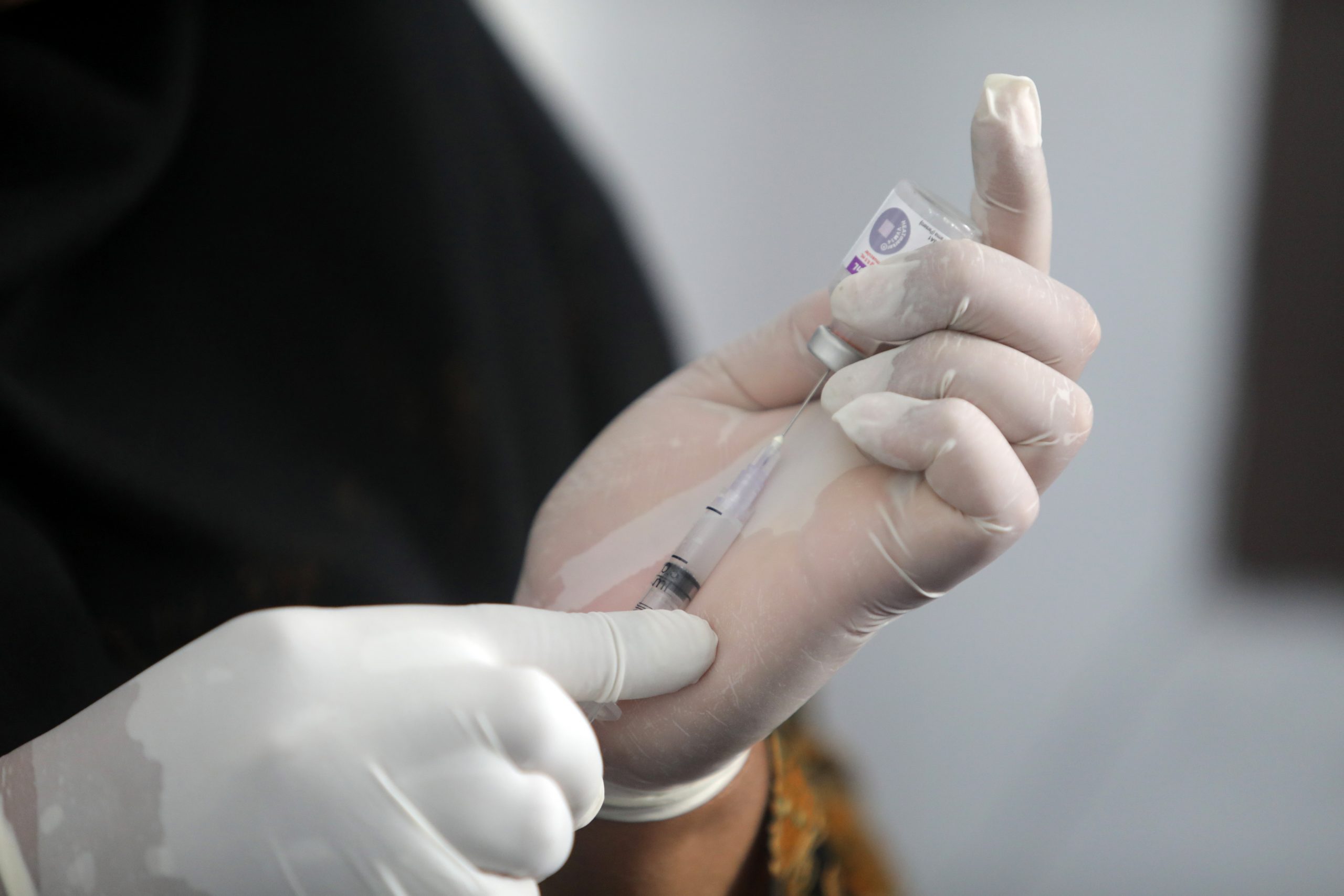 epa08287933 A nurse from Banda Aceh township public health department prepares vaccine injection for children during a regular vaccination in Banda Aceh, Indonesia, 12 March 2020. Nurses and health officials used the vaccination campaign to provide information to families about the coronavirus pandemic, instructing people on simple routines that could help prevent the spread of Covid-19.  EPA/HOTLI SIMANJUNTAK