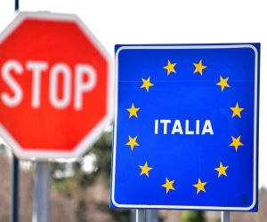 epa08288104 A sign showing the entrance to Italy hangs at a currently closed border point between Slovenia and Italy at Lipica, Slovenia, 12 March 2020. Slovenia imposed border restrictions with Italy starting 11 March, to prevent the spread of the novel coronavirus Covid-19. In an attempt to stop the spreading of the novel coronavirus Covid-19, Italian Prime Minister Conte announced on 09 March the extending of coronavirus quarantine measures to the entire country starting on 10 March until 03 April.  EPA/IGOR KUPLJENIK