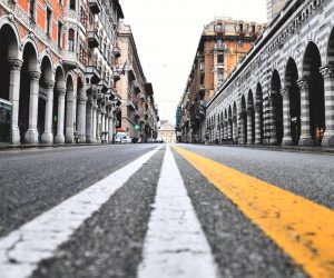 epa08289096 A view of a deserted road in the Genoa city center, northern Italy, 12 March 2020, during a national lockdown over the novel coronavirus crisis. Tougher lockdown measures kicked-in in Italy on the day after Italian Premier Conte announced the day earlier that all non-essential shops should close as part of the effort to contain the coronavirus. All of Italy is on lockdown until 03 April due to the novel coronavirus crisis.  EPA/LUCA ZENNARO