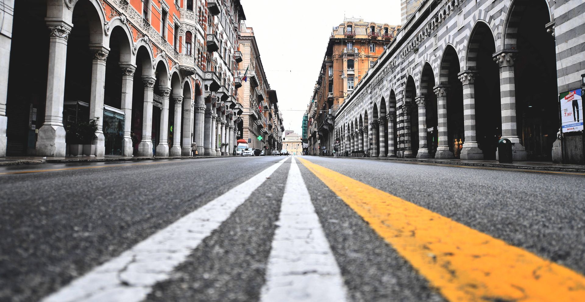 epa08289096 A view of a deserted road in the Genoa city center, northern Italy, 12 March 2020, during a national lockdown over the novel coronavirus crisis. Tougher lockdown measures kicked-in in Italy on the day after Italian Premier Conte announced the day earlier that all non-essential shops should close as part of the effort to contain the coronavirus. All of Italy is on lockdown until 03 April due to the novel coronavirus crisis.  EPA/LUCA ZENNARO