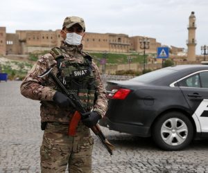 epa08293522 Members of the police and security stand guard in center of Erbil, after additional restrictions decided to slow the spread of Coronavirus, in Erbil, Capital of the Kurdistan region, 14 March 2020. Tough lockdown measures kicked in throughout Kurdistan Region on 14 March.  EPA/GAILAN HAJI