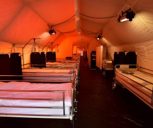 epa08301739 View of mobile hospital tents with a total capacity for 120 beds set up by the Slovenian Army at the Edvard Peperko Barracks in Ljubljana, Slovenia, 17 March 2020. The Slovenian government has halted public transport and shut down most shops in a bid to slow down the spread of the COVID-19 disease caused by the SARS-CoV-2 coronavirus. Slovenia, a tiny country of just over 2 million inhabitants that borders the coronavirus hotspot of northern Italy, has recorded at least 253 confirmed cases of the disease, with no deaths reported so far.  EPA/IGOR KUPLJENIK