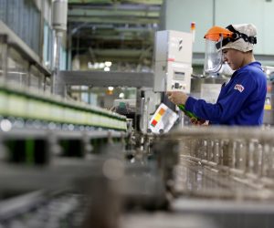 FILE PHOTO: Employee works at Japanese brewer Kirin Holdings' factory in Toride, Japan FILE PHOTO: Japan workers' wage raises for next fiscal year are set to be restrained. An employee works at a beer production line at Japanese brewer Kirin Holdings' factory in Toride, Ibaraki Prefecture, Japan July 14, 2017. REUTERS/Kim Kyung-Hoon/File Photo Kim Kyung Hoon