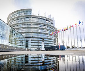 Building of the European parliament in Strasbourg - Reflection of Louise Weiss building in water puddle - Fall season
