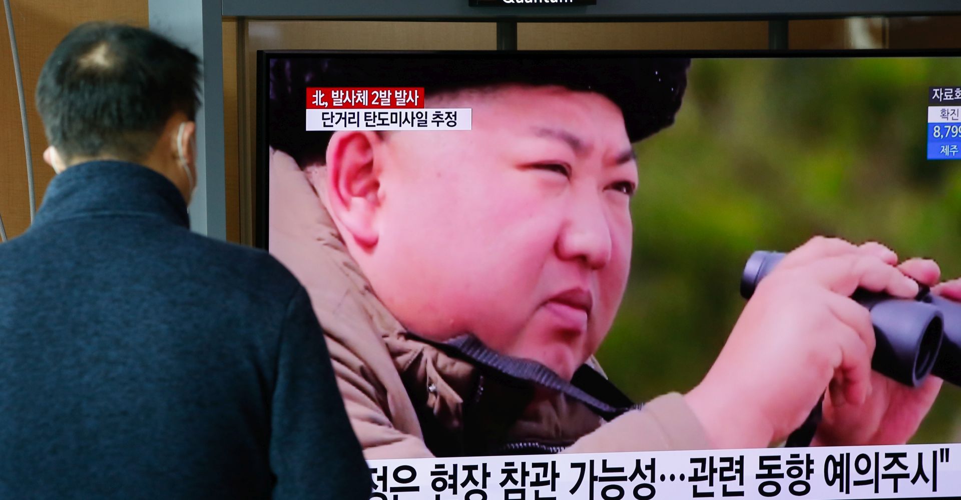 epa08310940 A South Korean person watches breaking news of North Korea's projectile launch, at Seoul Station in Seoul, South Korea, 21 March 2020. According to South Korea's military, North Korea on 21 March fired two short-range ballistic missiles toward the East Sea.  EPA/KIM HEE-CHUL