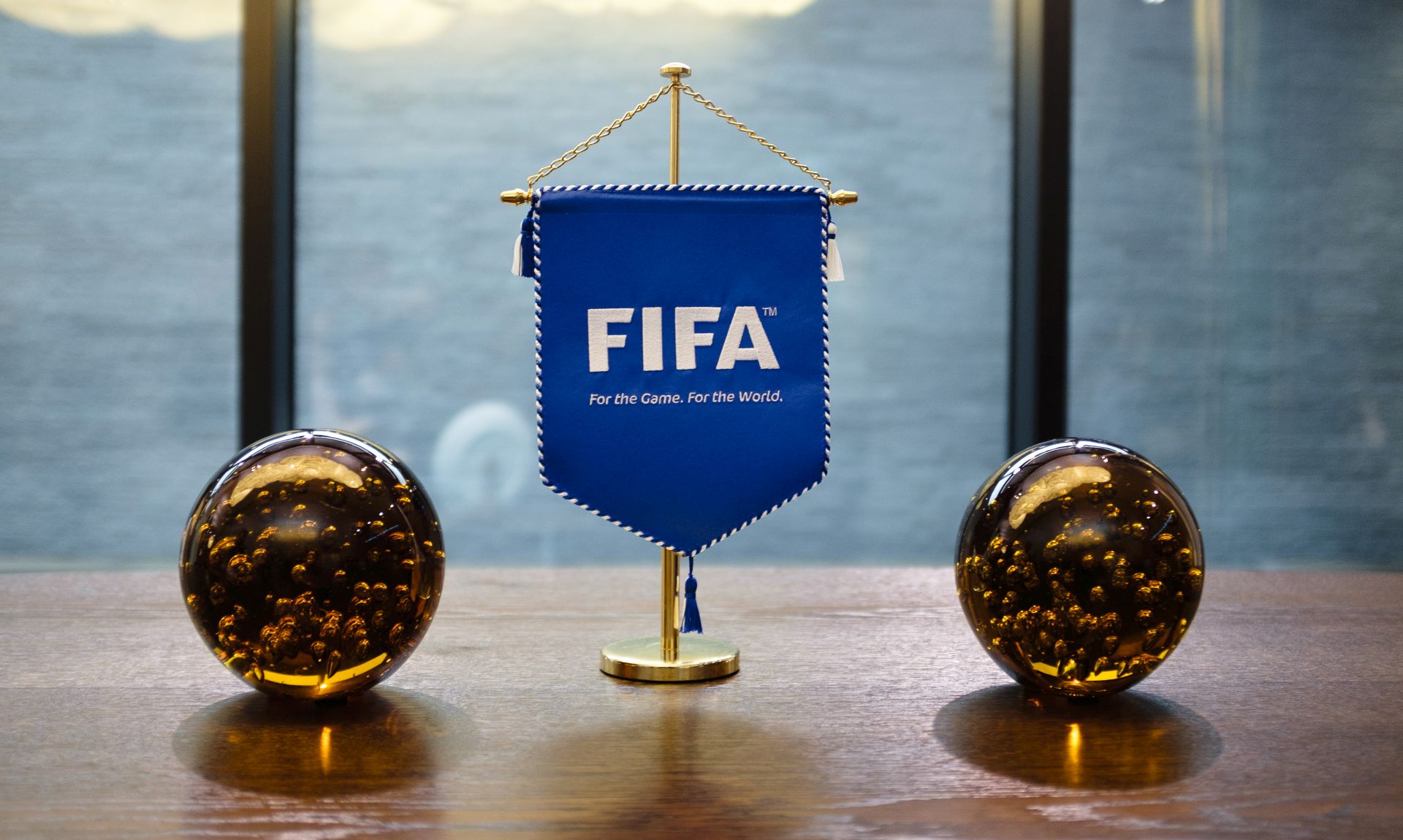 epa08334972 (FILE) - View of the FIFA logo displayed on a pennant at the FIFA headquarters in Zurich, Switzerland, 01 October 2016 (re-issued on 31 March 2020). The world governing body FIFA will set up a fund to assist competitions and players which have run into financial trouble because of the ongoing coronavirus COVID-19 pandemic, media reports stated on 31 March 2020.  EPA/MANUEL LOPEZ *** Local Caption *** 53048326