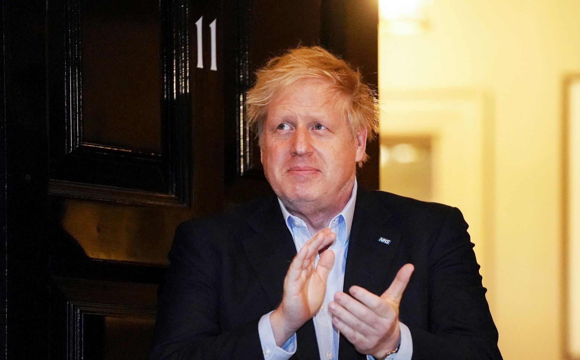 epa08339744 A handout photo made available by No. 10 Downing Street of Britain's Prime Minister Boris Johnson applauding during a 'Claps for our Carers' outside 11 Downing Street in London, Britain, 02 April March 2020. Boris Johnson, who is self-isolating in Downing Street after contracting the pandemic COVID-19 disease caused by the SARS-CoV-2 coronavirus himself, is facing criticism over his government's testing strategy.  EPA/PIPPA FOWLES / DOWNING STREET HANDOUT  HANDOUT EDITORIAL USE ONLY/NO SALES