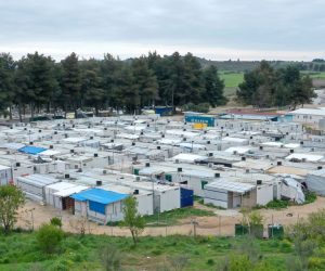 epa08340581 A photograph taken with a drone shows the refugee camp of Ritsona, north of Athens, Greece, 03 April 2020. Deputy Minister for Civil Protection and Crisis Management Nikos Hardalias confirmed on 03 April 2020 that the Ritsona refugee and asylum-seekers facility has been placed on lockdown for the next 14 days as of Thursday morning, after 23 residents so far tested positive for the novel coronavirus.At Ritsona camp lives 2.800 people.  EPA/ANDREAS TSAKNARIDIS